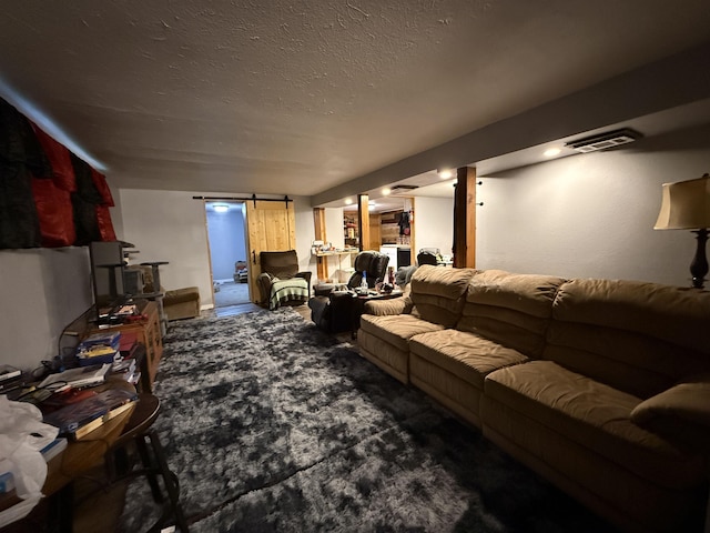 3301 SE 1st St, Minot, ND 58701 - living area featuring a barn door, carpet floors, and a textured ceiling
