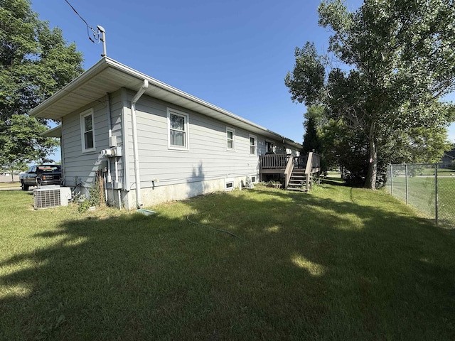 3301 SE 1st St, Minot, ND 58701 - back of property featuring a wooden deck