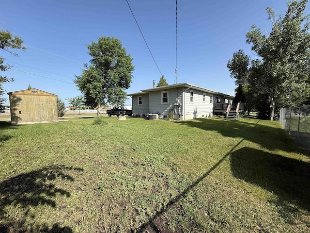 3301 SE 1st St, Minot, ND 58701 - view of yard with a shed and a wooden deck