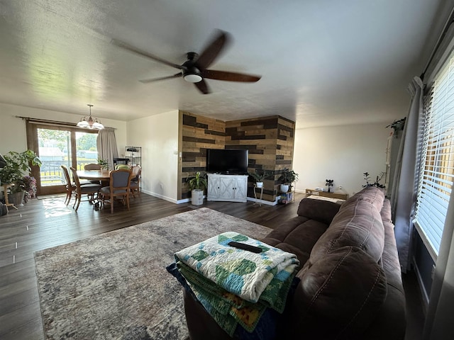 3301 SE 1st St, Minot, ND 58701 - living area featuring a ceiling fan, dark wood-style flooring, and healthy amount of natural light