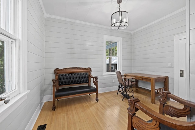 519 4th St, Minot, ND 58701 - office space featuring ornamental molding, light wood-type flooring, a chandelier, and wooden walls
