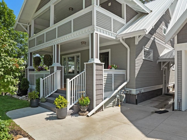 519 4th St, Minot, ND 58701 - view of exterior entry with a porch