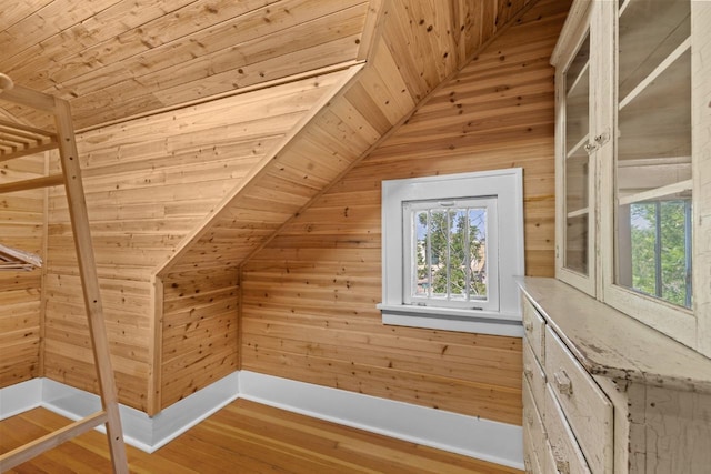 519 4th St, Minot, ND 58701 - bonus room with lofted ceiling, wood ceiling, wooden walls, and wood finished floors