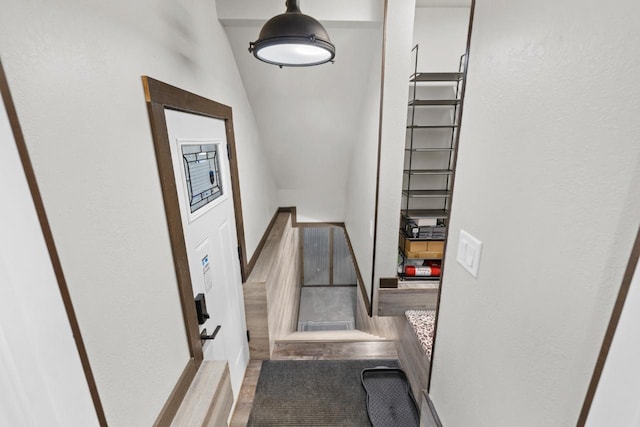 519 4th St, Minot, ND 58701 - stairs with a textured wall and wood finished floors
