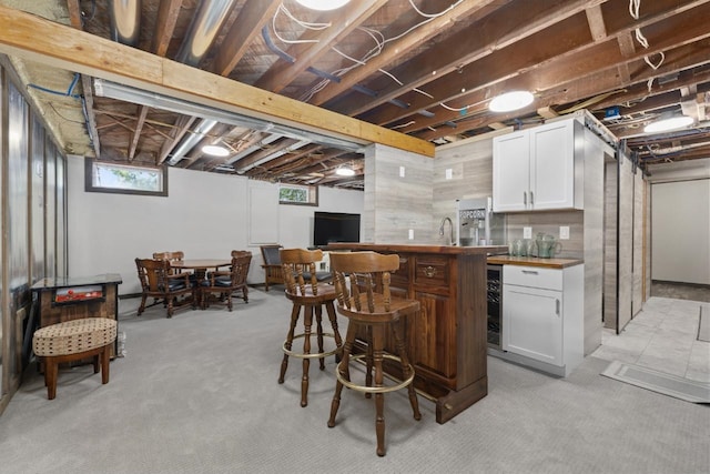 519 4th St, Minot, ND 58701 - indoor bar with beverage cooler and light carpet