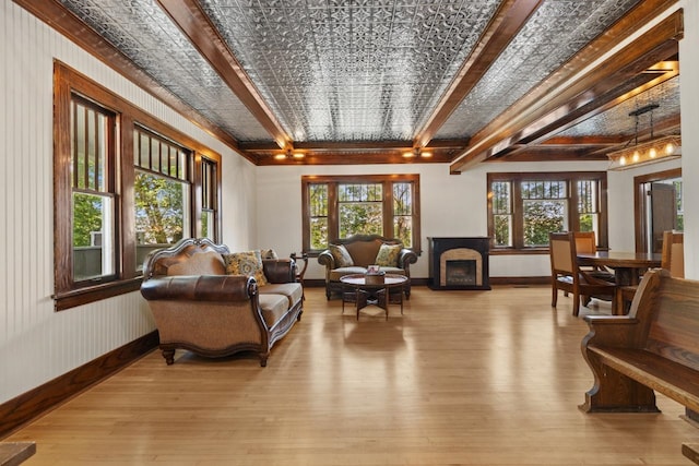 519 4th St, Minot, ND 58701 - living room featuring light wood-style floors and beam ceiling