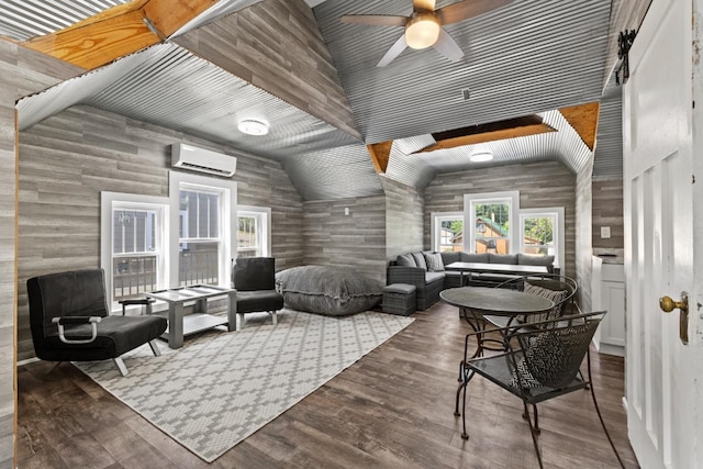 519 4th St, Minot, ND 58701 - living area featuring an AC wall unit, ceiling fan, wood finished floors, and lofted ceiling