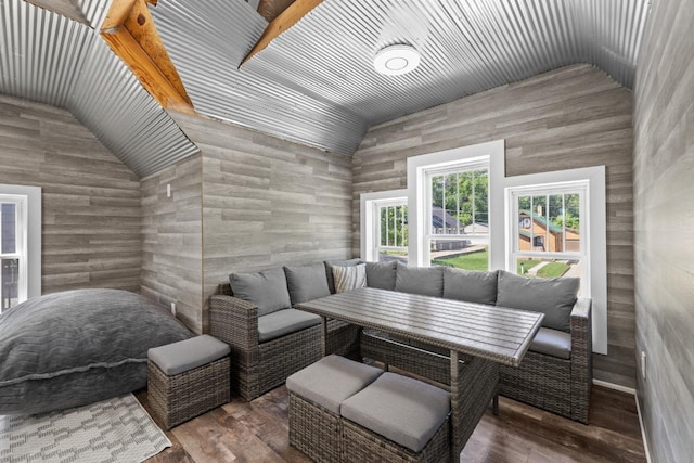 519 4th St, Minot, ND 58701 - living area featuring lofted ceiling and wood finished floors