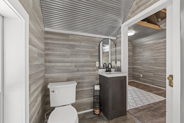 519 4th St, Minot, ND 58701 - bathroom with vanity and tile walls