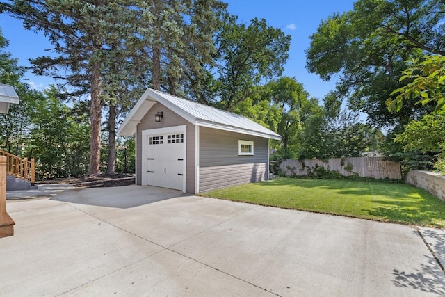519 4th St, Minot, ND 58701 - detached garage featuring concrete driveway