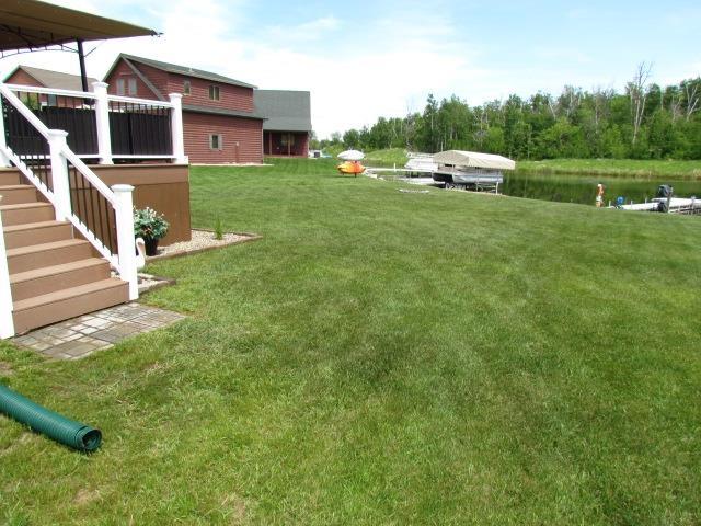 83 Hahns Bay Rd, Lake Metigoshe, ND 58318 - view of green lawn