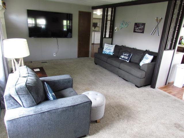 83 Hahns Bay Rd, Lake Metigoshe, ND 58318 - view of carpeted living area