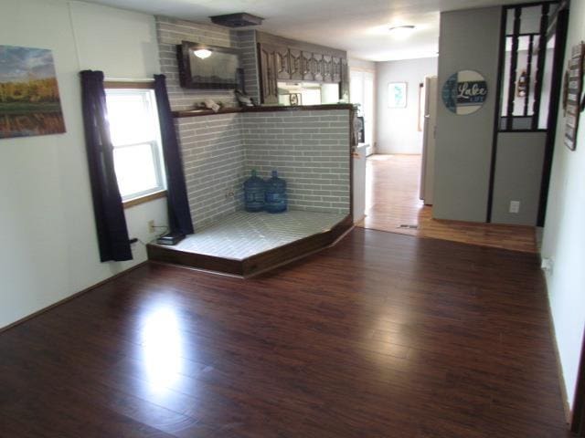83 Hahns Bay Rd, Lake Metigoshe, ND 58318 - living room featuring wood finished floors and plenty of natural light
