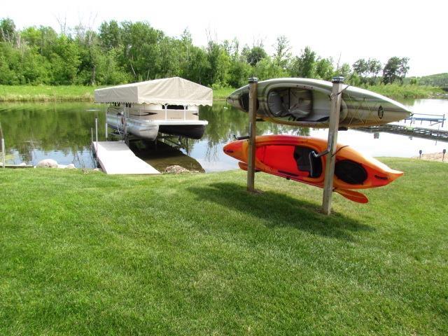 83 Hahns Bay Rd, Lake Metigoshe, ND 58318 - dock with a water view and a lawn