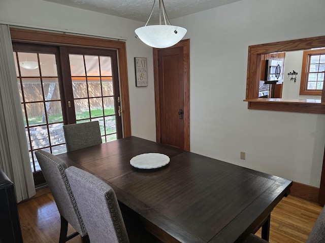 209 University Ave, Minot, ND 58703 - dining area featuring wood finished floors