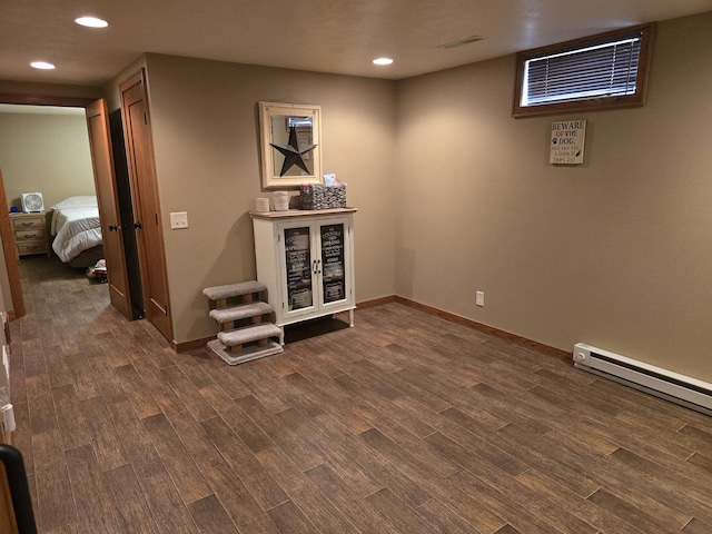 209 University Ave, Minot, ND 58703 - finished below grade area with dark wood-style flooring and recessed lighting