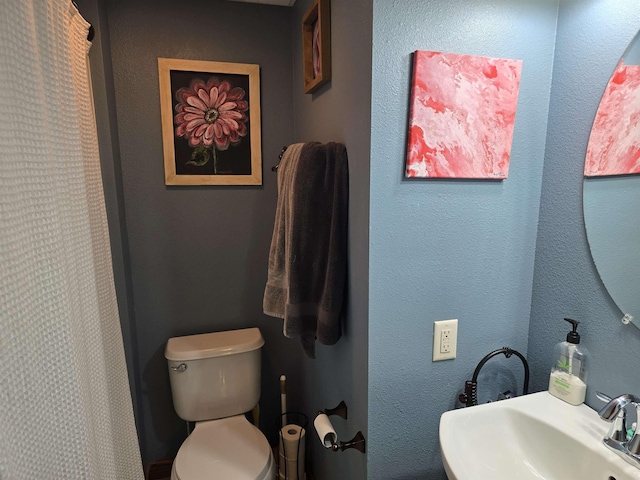 209 University Ave, Minot, ND 58703 - full bathroom with toilet and a shower with shower curtain