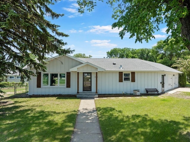 615 18th Ave, Minot, ND 58701 - view of front of property with board and batten siding and roof with shingles