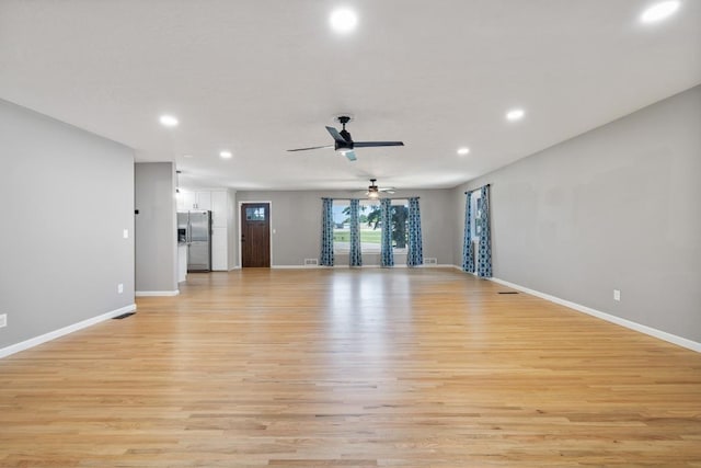 615 18th Ave, Minot, ND 58701 - unfurnished living room featuring recessed lighting, light wood-type flooring, and a ceiling fan