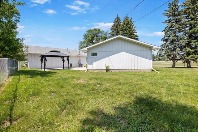 615 18th Ave, Minot, ND 58701 - rear view of house featuring a gazebo