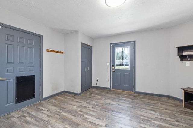 615 18th Ave, Minot, ND 58701 - entrance foyer featuring wood finished floors and baseboards