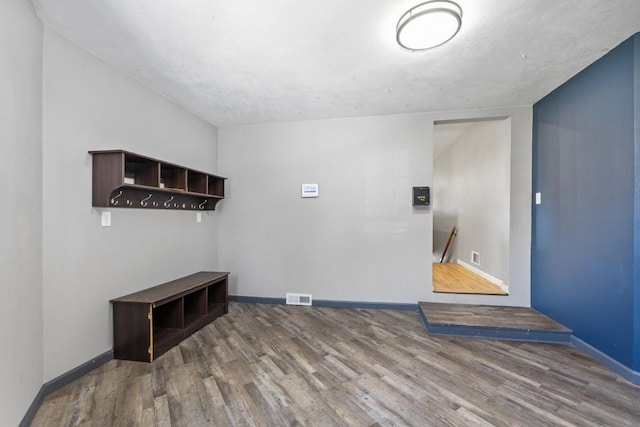 615 18th Ave, Minot, ND 58701 - spare room featuring baseboards and wood finished floors