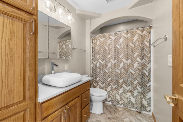 1949 24th St, Minot, ND 58701 - bathroom featuring vanity and a shower with curtain