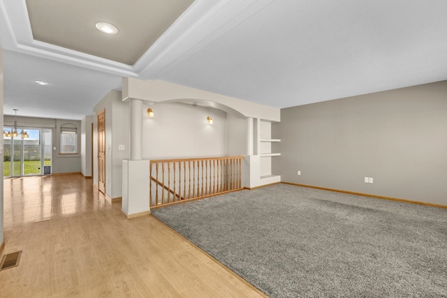 1949 24th St, Minot, ND 58701 - spare room with wood finished floors, a chandelier, and recessed lighting