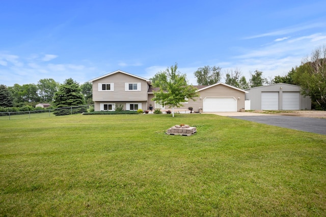 2710 66th St, Minot, ND 58703 - tri-level home featuring a detached garage