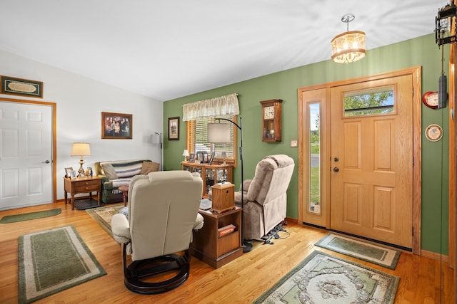 2710 66th St, Minot, ND 58703 - foyer featuring lofted ceiling and light wood-style floors