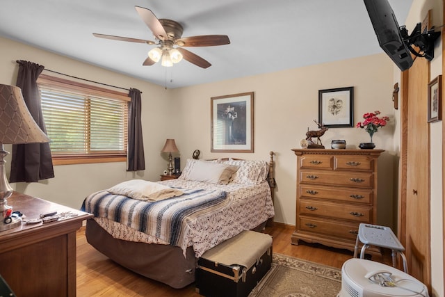 2710 66th St, Minot, ND 58703 - bedroom featuring light wood finished floors and ceiling fan