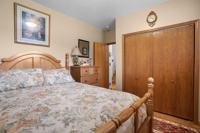 2710 66th St, Minot, ND 58703 - bedroom featuring a closet and wood finished floors