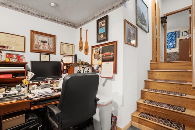 2710 66th St, Minot, ND 58703 - office area with a textured ceiling and baseboards