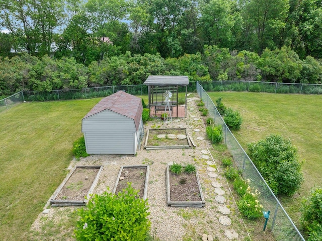 2710 66th St, Minot, ND 58703 - view of yard featuring a garden and a storage unit