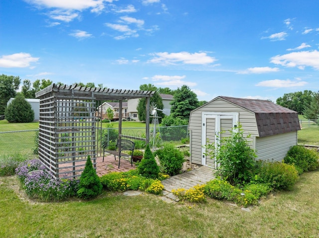 2710 66th St, Minot, ND 58703 - view of yard with a shed and a pergola
