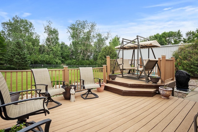 2710 66th St, Minot, ND 58703 - wooden terrace featuring a grill