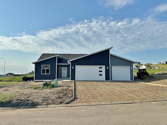 1609 Heights Ave, Burlington, ND 58722 - view of front facade featuring a garage and driveway