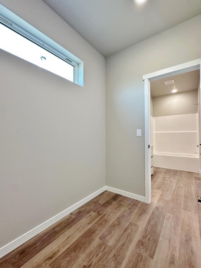1609 Heights Ave, Burlington, ND 58722 - spare room featuring light wood-style flooring and baseboards