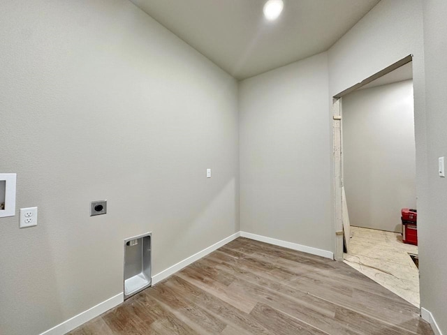 1609 Heights Ave, Burlington, ND 58722 - washroom with hookup for an electric dryer, wood finished floors, and hookup for a washing machine