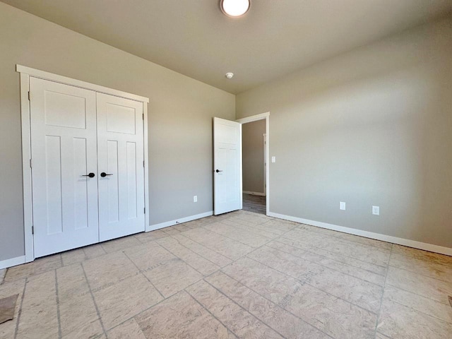 1609 Heights Ave, Burlington, ND 58722 - unfurnished bedroom featuring baseboards and a closet