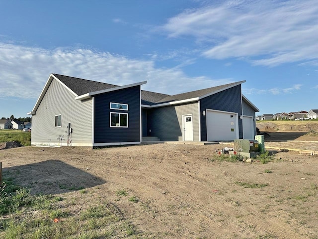 1609 Heights Ave, Burlington, ND 58722 - view of front of home featuring a garage and driveway