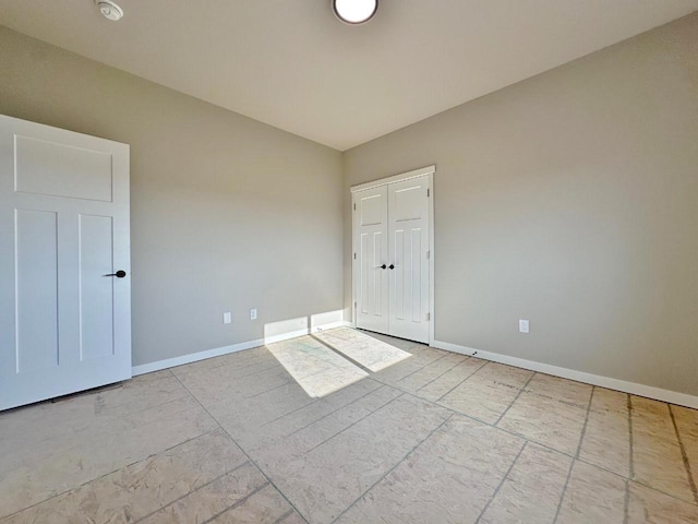1609 Heights Ave, Burlington, ND 58722 - unfurnished bedroom featuring baseboards and a closet