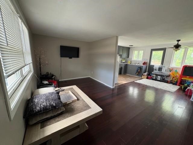 724 Burdick Expy, Minot, ND 58701 - living area featuring healthy amount of natural light, wood finished floors, and ceiling fan