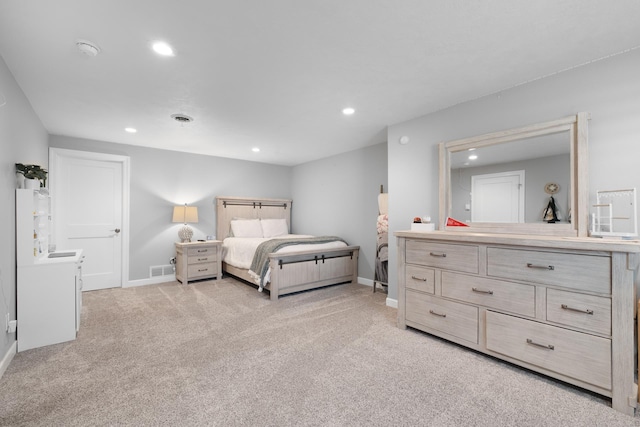 2009 35th Ave, Minot, ND 58701 - bedroom featuring recessed lighting and light carpet