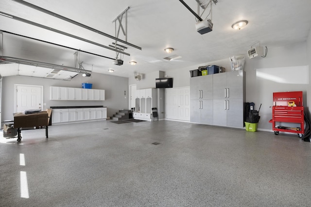 2009 35th Ave, Minot, ND 58701 - garage featuring a garage door opener