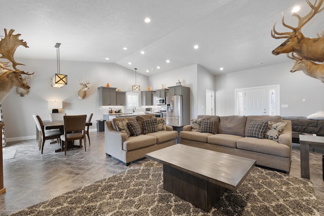 2009 35th Ave, Minot, ND 58701 - living room featuring recessed lighting, high vaulted ceiling, and marble finish floors
