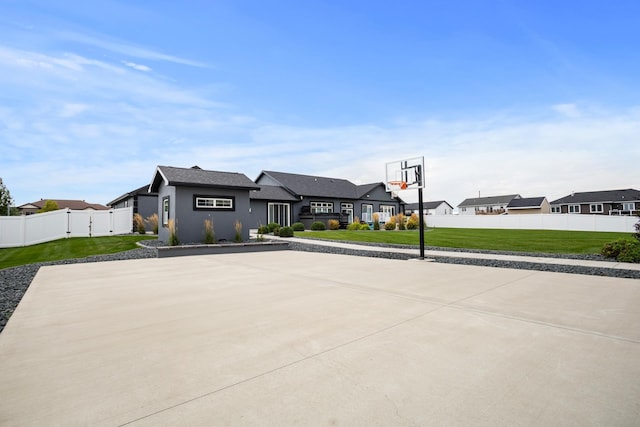2009 35th Ave, Minot, ND 58701 - view of sport court featuring a residential view and basketball court