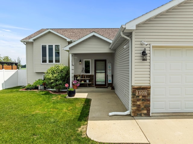 1808 28th St, Minot, ND 58703 - view of front of house with a shingled roof and an attached garage