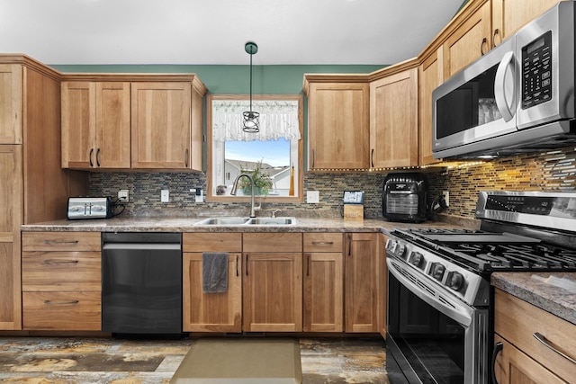 1808 28th St, Minot, ND 58703 - kitchen with stainless steel appliances, backsplash, decorative light fixtures, and dark wood-style flooring