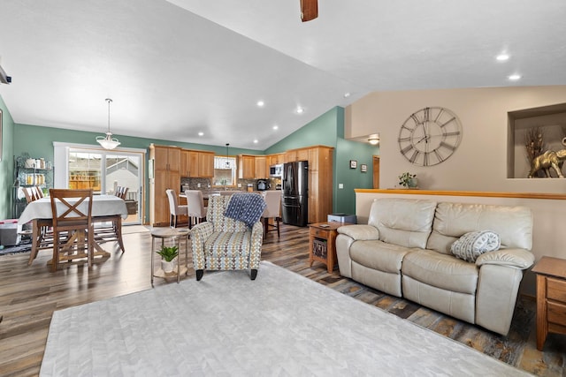 1808 28th St, Minot, ND 58703 - living room with wood finished floors, recessed lighting, vaulted ceiling, and a ceiling fan